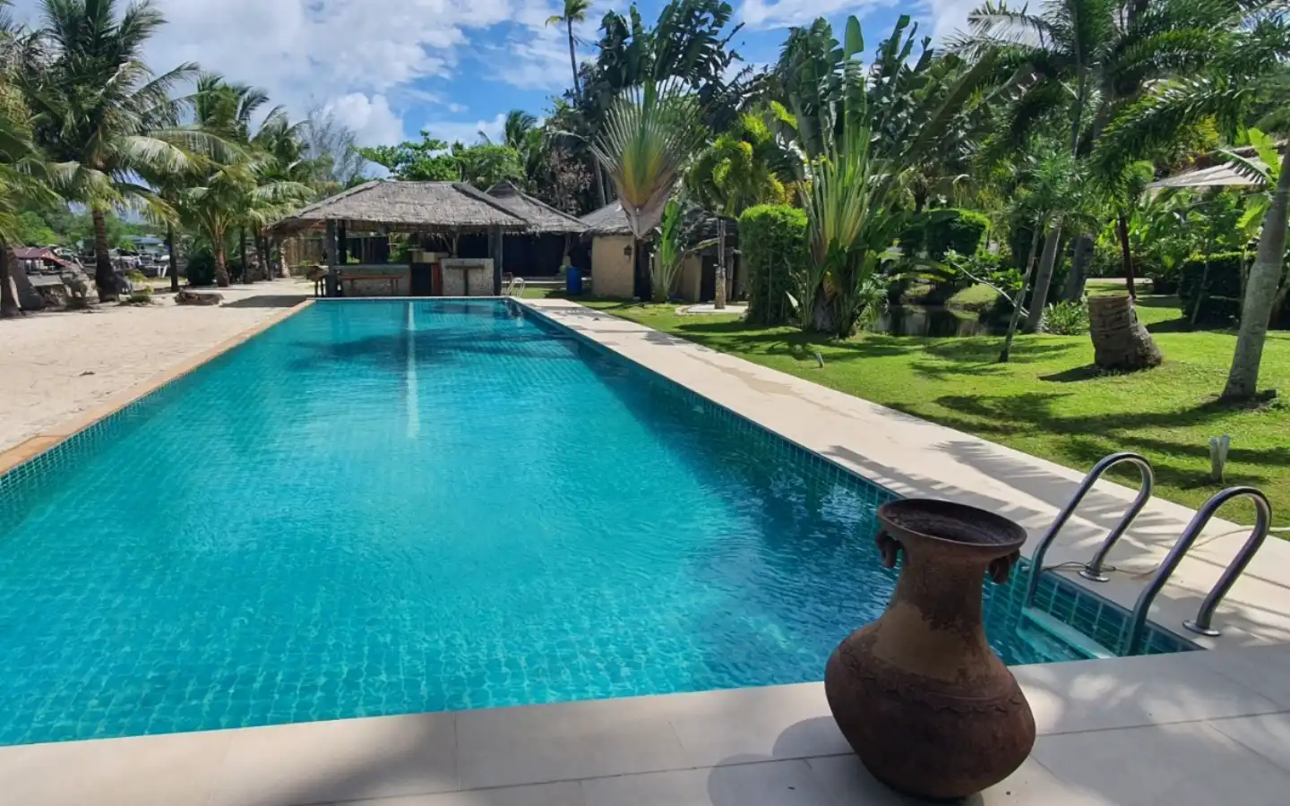 Exterior view of Two Beachfront Bungalows for Sale on Coconut Island - Sold as One